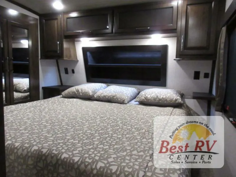 Bedroom with overhead cabinets.