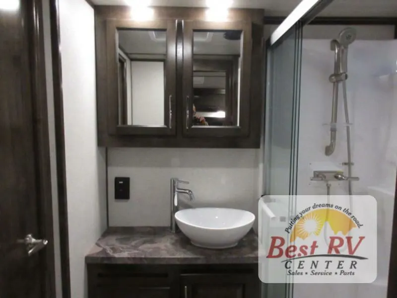 Bathroom with a sink and a walk-in shower.