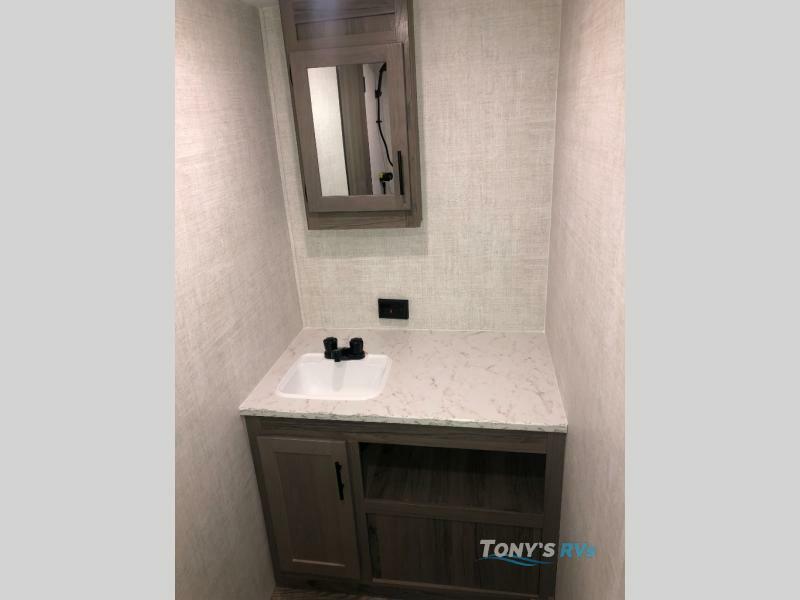 Bathroom with a sink and medicine cabinet.