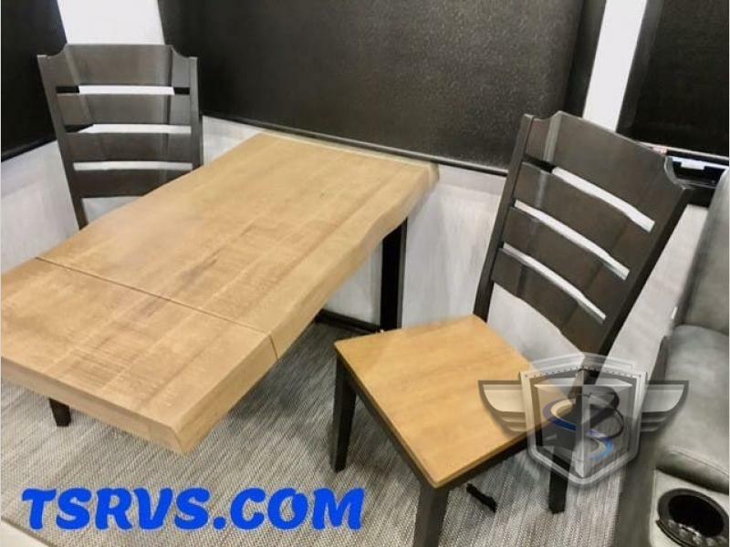 Dinette with a wooden table and chairs.