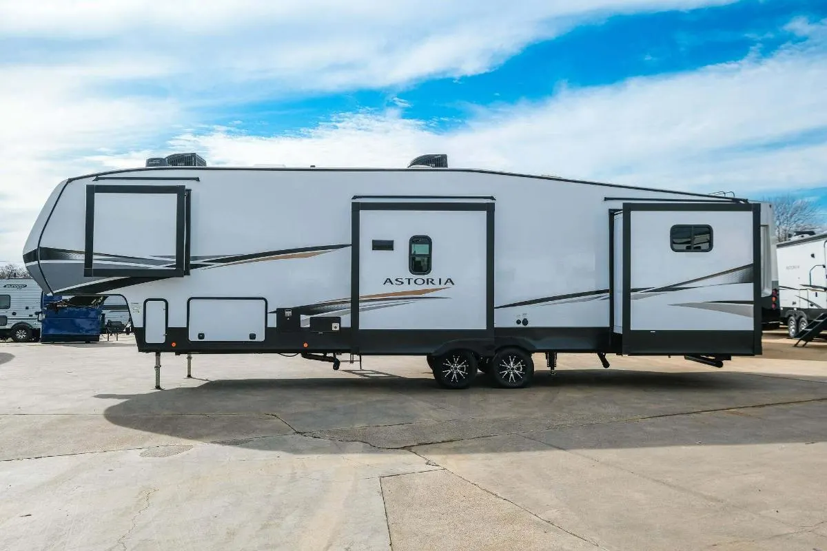 Side view of the New 2022 Dutchmen Astoria 3343BHF Fifth Wheel RV.