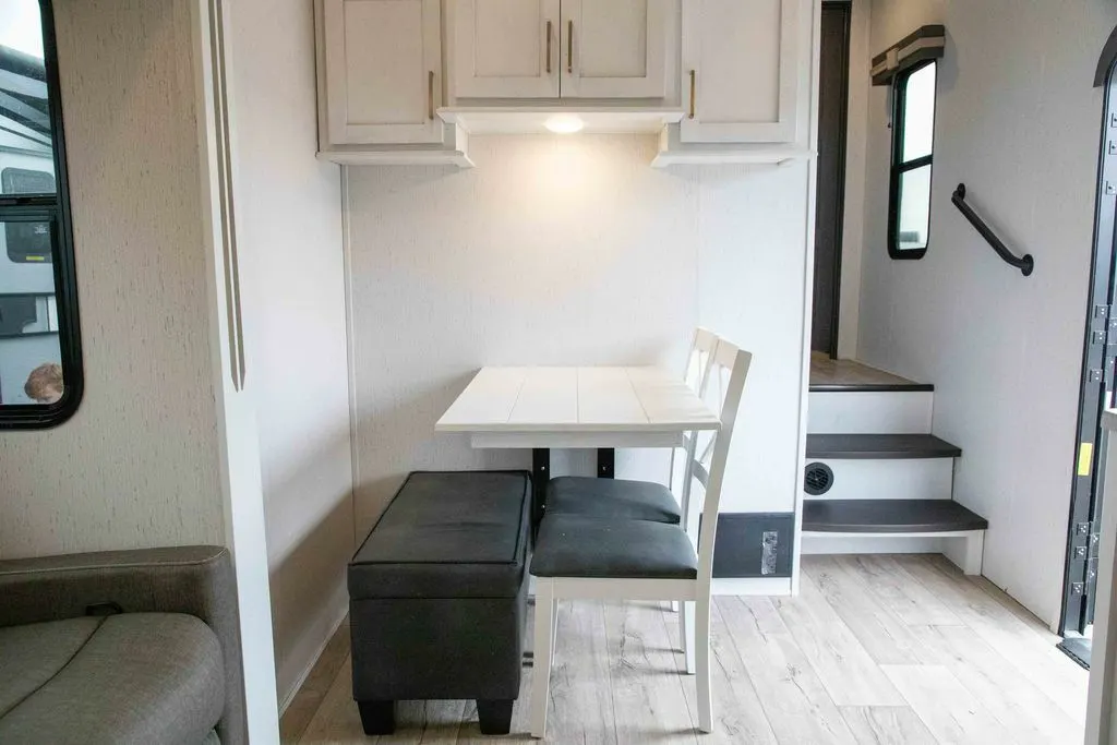 Dinette with overhead cabinets.