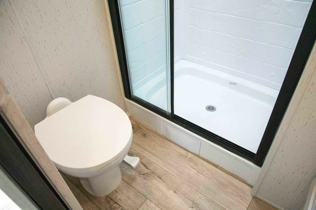 Bathroom with a toilet and a walk-in shower.