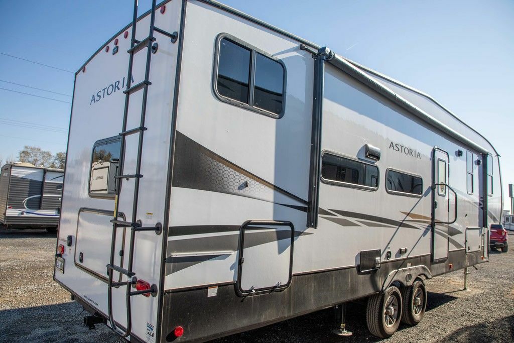 Side view of the New 2022 Dutchmen Astoria 1500 2943BHF Fifth Wheel RV.