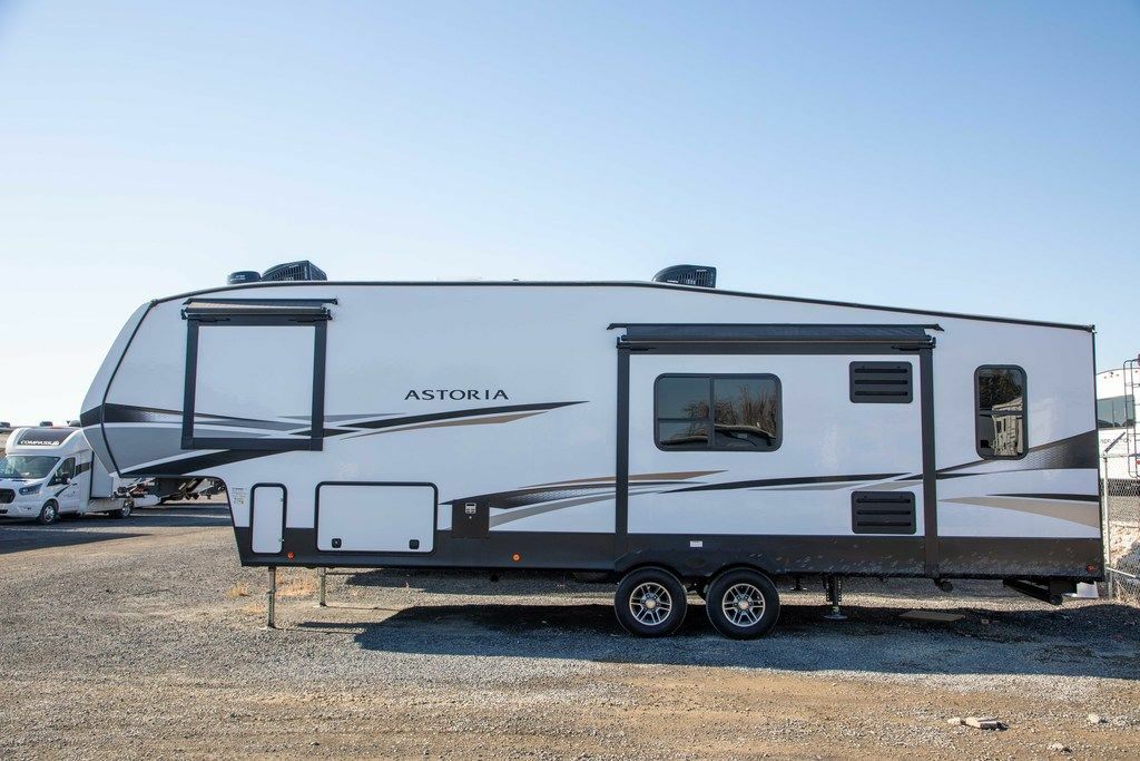 Side view of the New 2022 Dutchmen Astoria 1500 2943BHF Fifth Wheel RV.