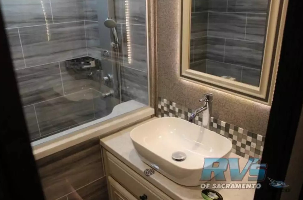 Bathroom with a sink and a walk-in shower.