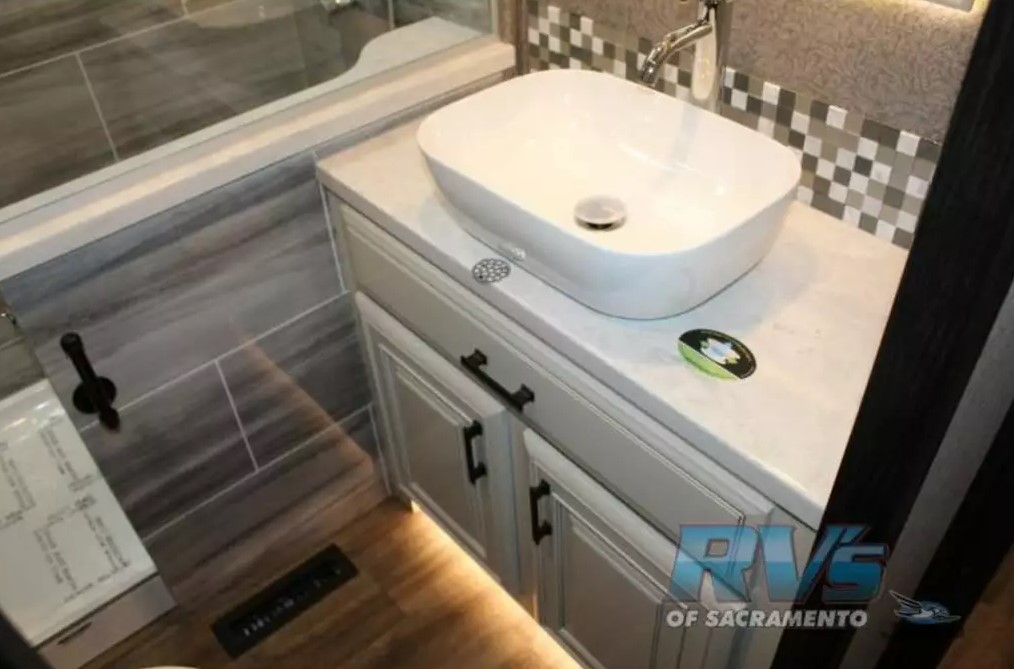 Bathroom with a sink and a walk-in shower.