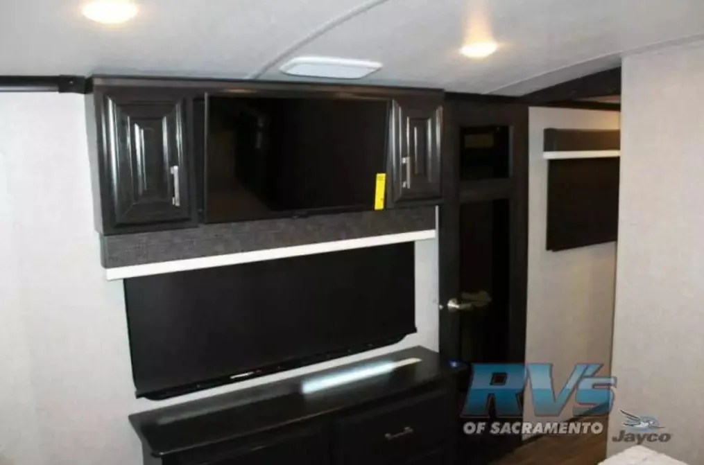 Bedroom with a TV and a dresser.