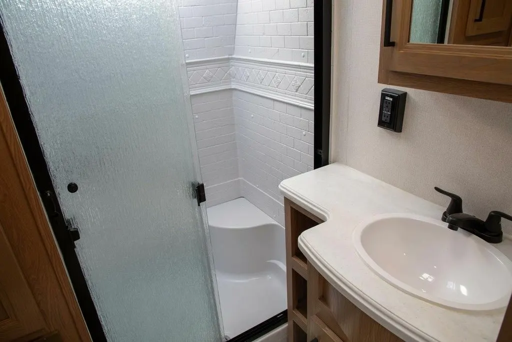 Bathroom with a sink and a walk-in shower.