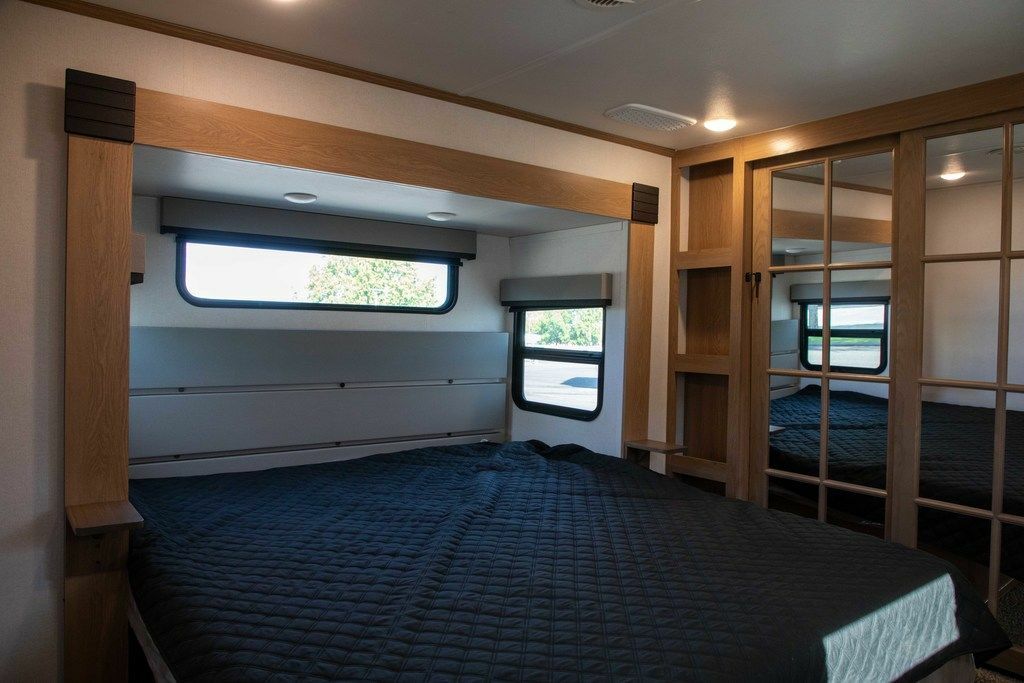 Bedroom with a king size bed and a closet.