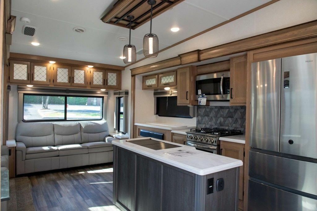 Interior view of the RV with a living space and a kitchen.