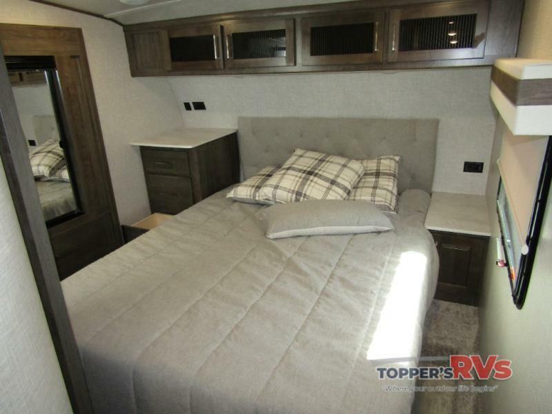 Bedroom with overhead cabinets.