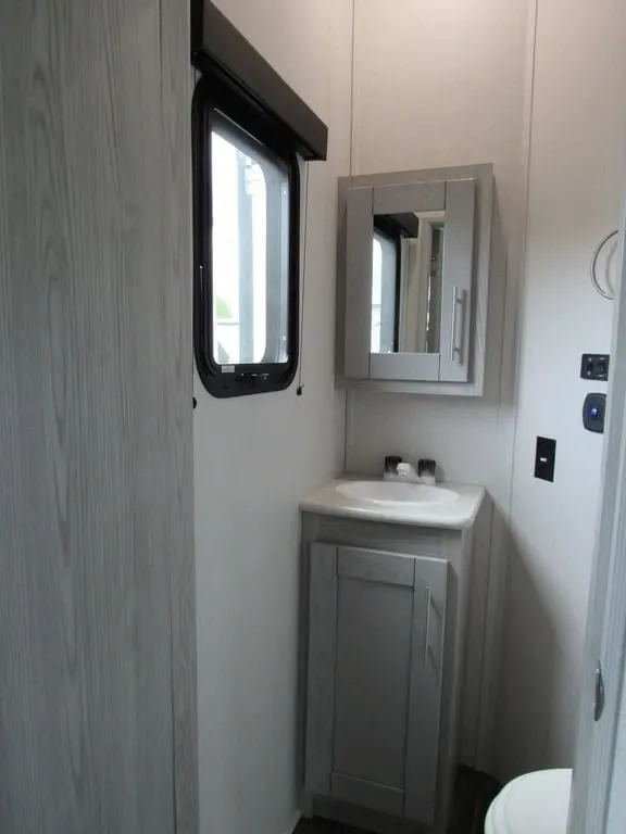 Bathroom sink with a medicine cabinet.