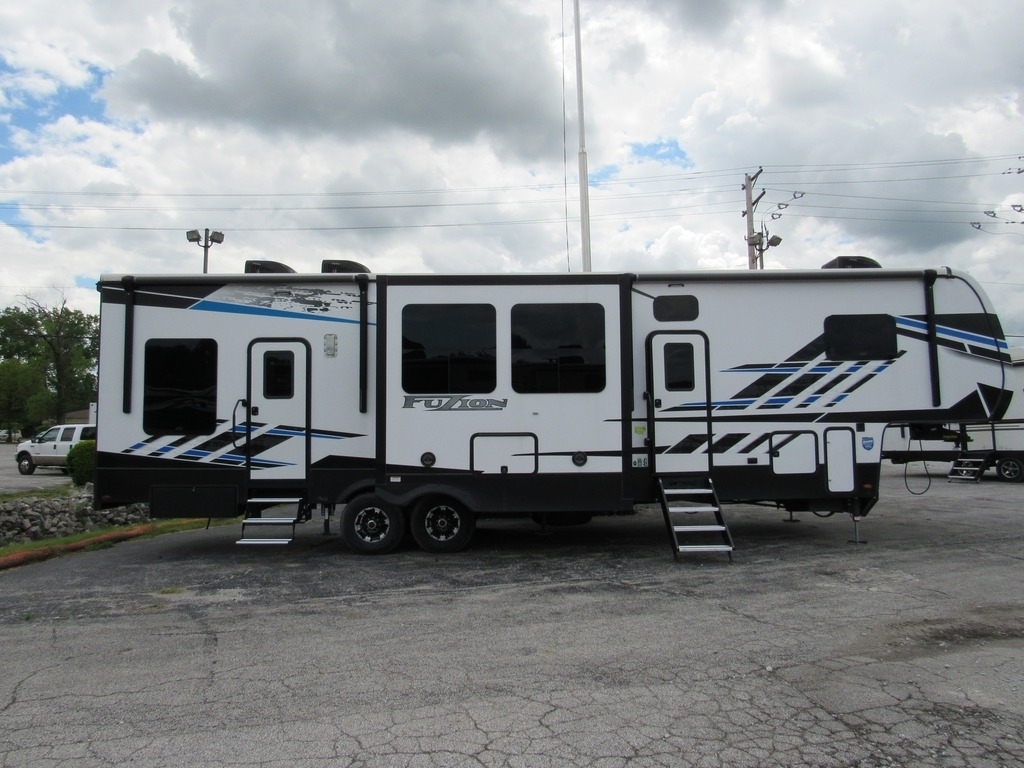 Side view of the New 2022 Keystone Fuzion 373 Fifth Wheel Toy Hauler RV.