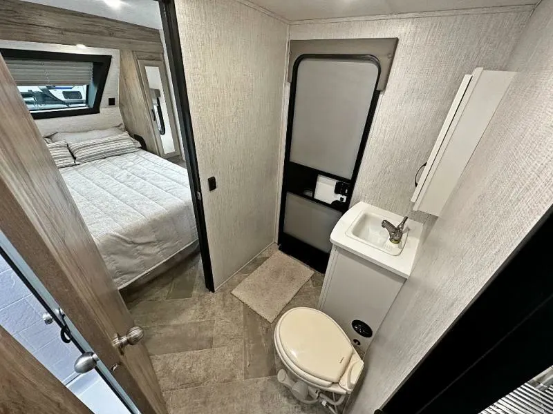 Bathroom with a sink, toilet and a walk-in shower.