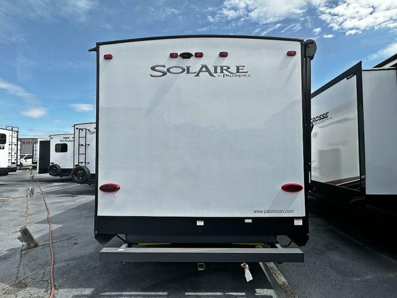 Rear view of the New 2022 Palomino SolAire Ultra Lite 315DQBH Travel Trailer RV.