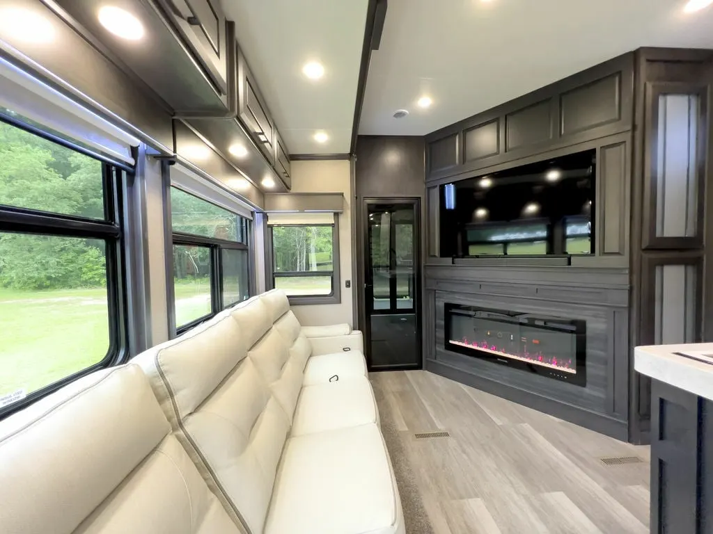 Living space with a TV and a fireplace.