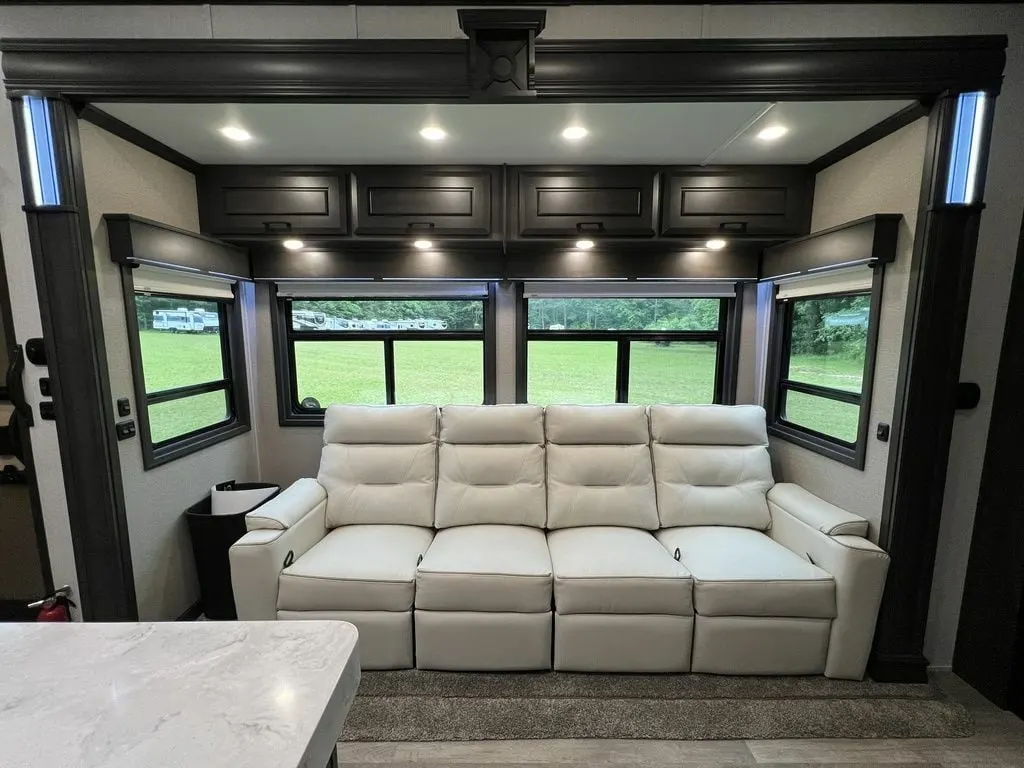 Living space with overhead cabinets.