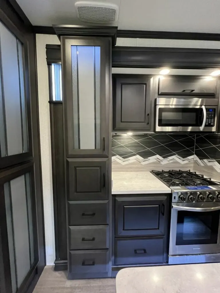 Kitchen with a gas burner, oven, and cabinets.