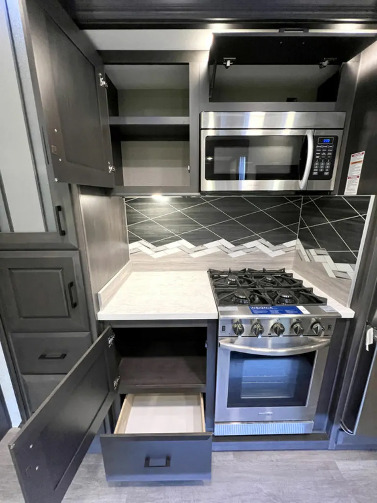 Kitchen with a gas burner, oven, and cabinets.