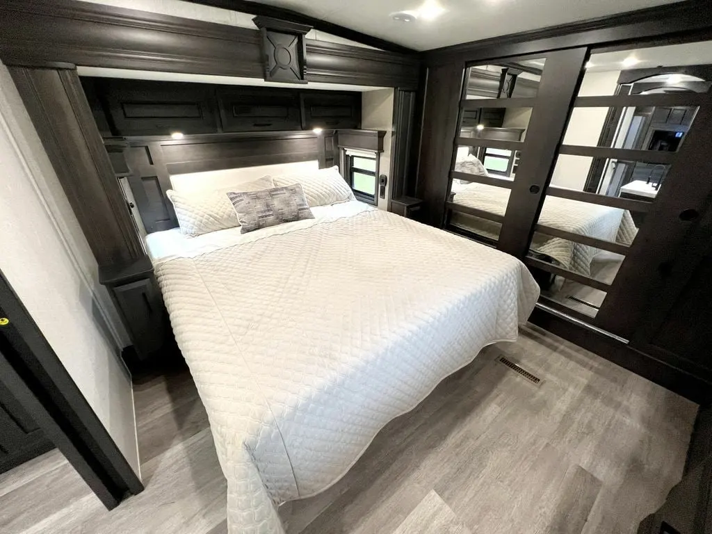 Bedroom with a king size bed and a closet.