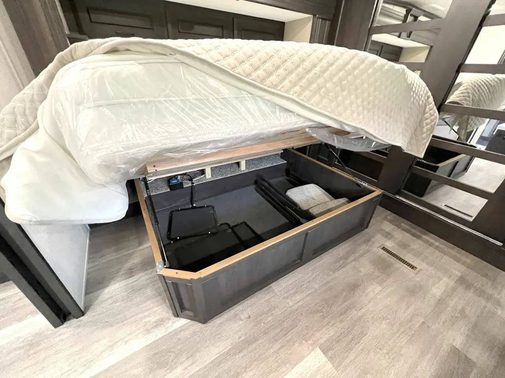 Bedroom with pull-out storage drawers.