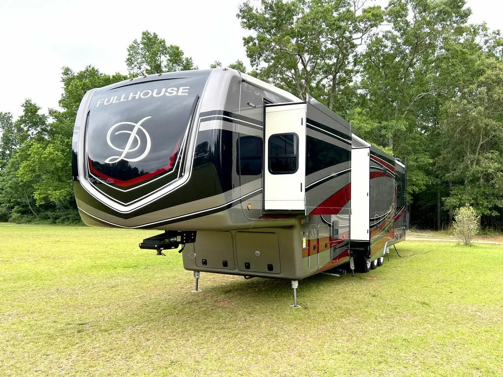 Front view of the New 2022 DRV Fifth Wheel Fullhouse Full House Luxury LX455 Toy Hauler RV.