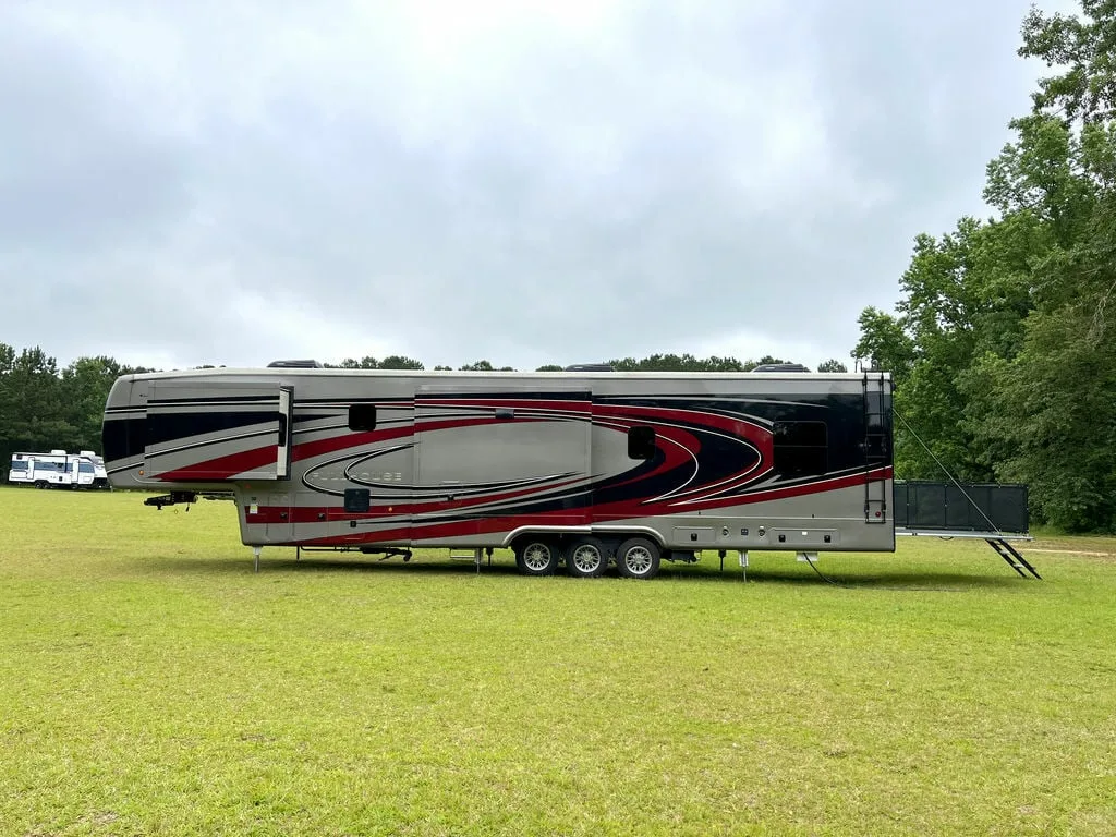 Side view of the New 2022 DRV Fifth Wheel Fullhouse Full House Luxury LX455 Toy Hauler RV.