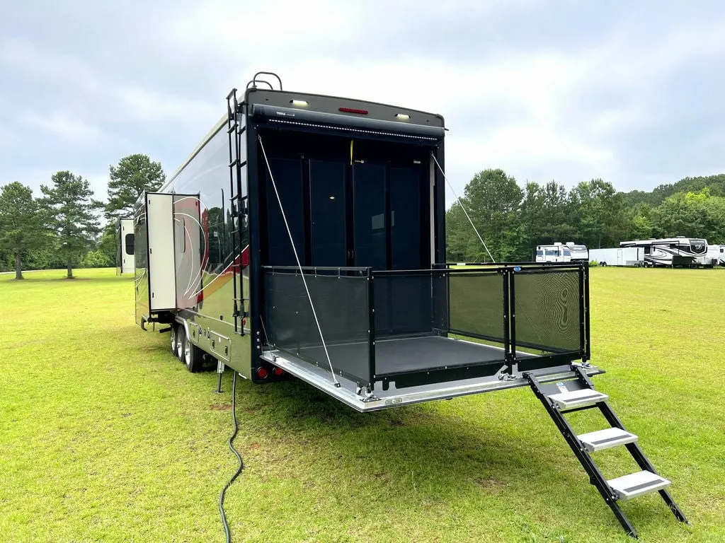 Rear view of the New 2022 DRV Fifth Wheel Fullhouse Full House Luxury LX455 Toy Hauler RV.