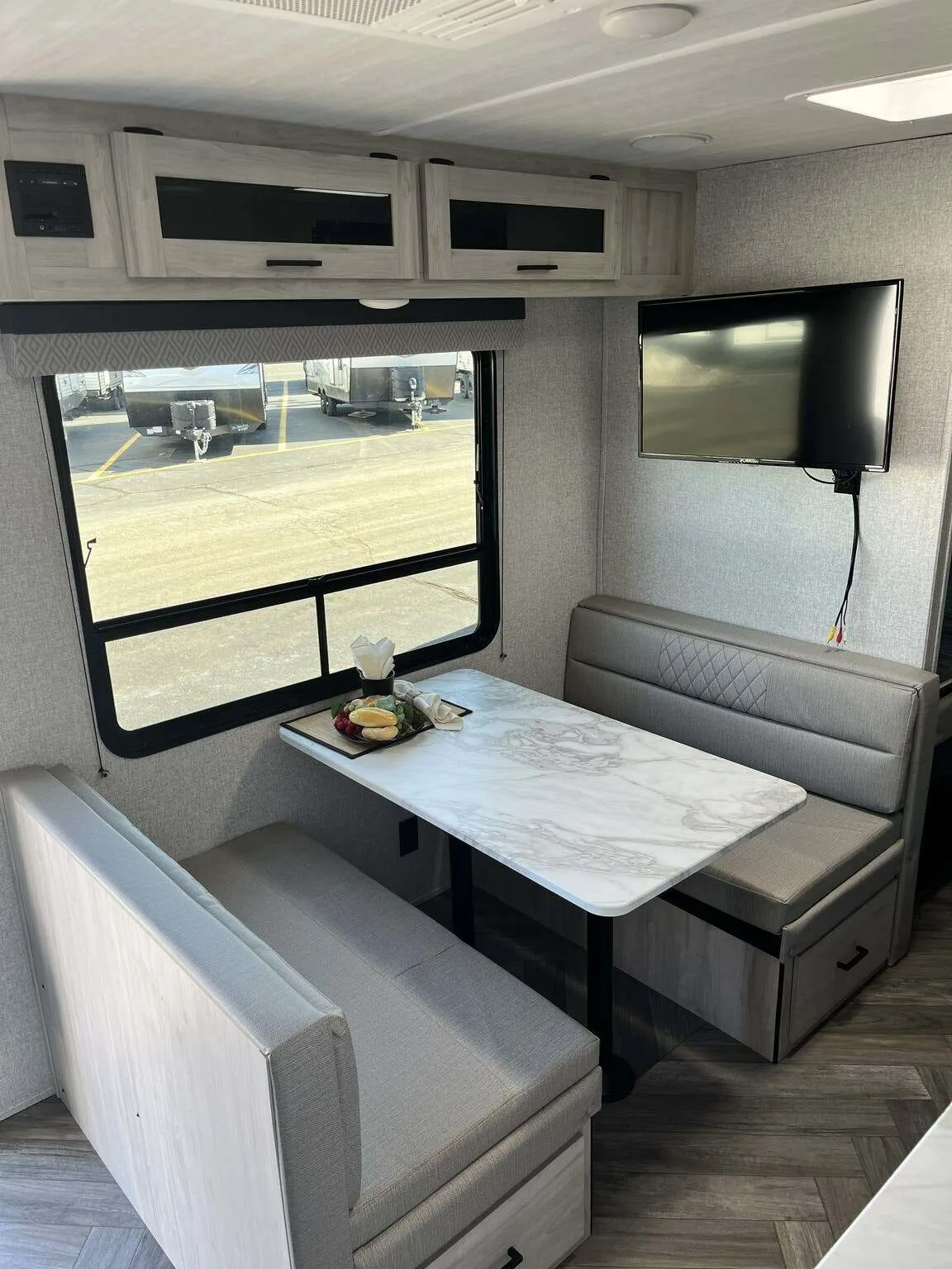 Dinette with overhead cabinets.