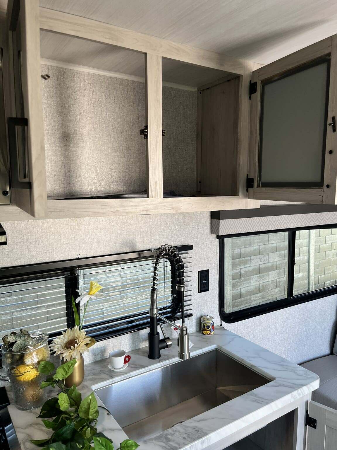 Kitchen sink and cabinets.