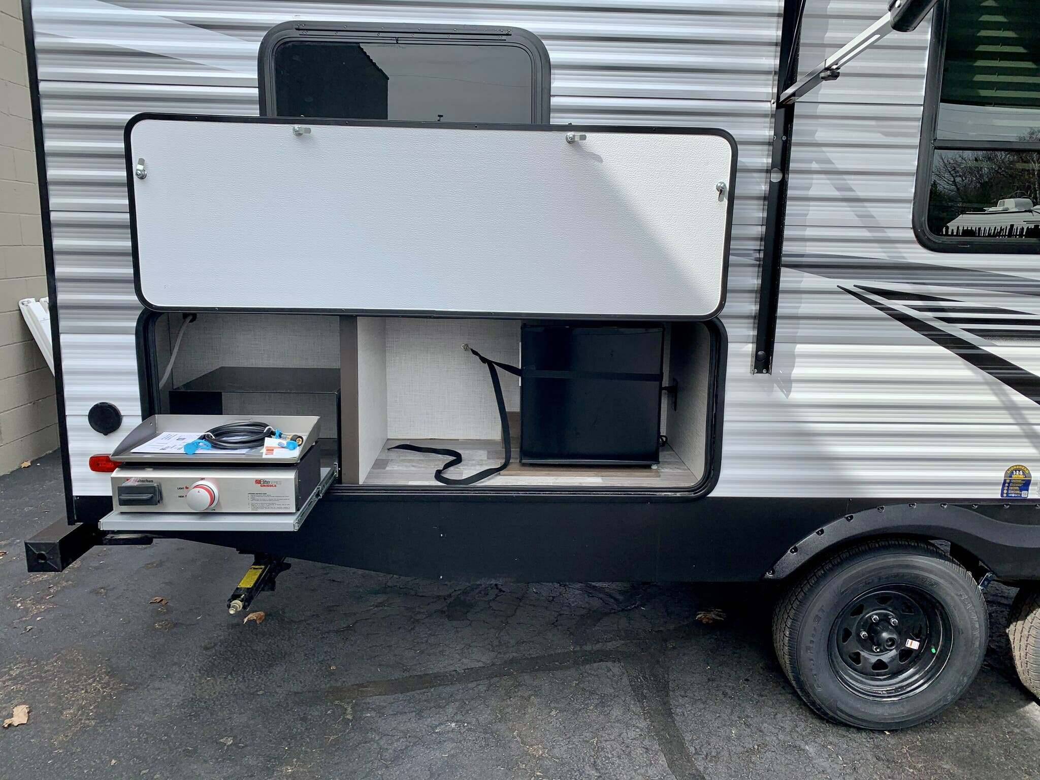 Outdoor kitchen with a gas burner.