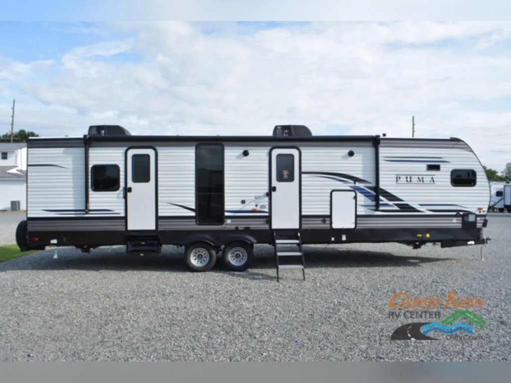 Side view of the New 2024 Palomino Puma 31FKRK Travel Trailer RV.