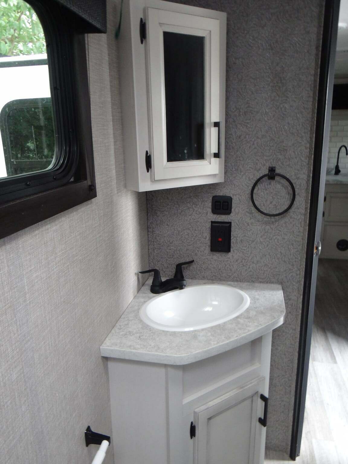 Bathroom sink and medicine cabinet.