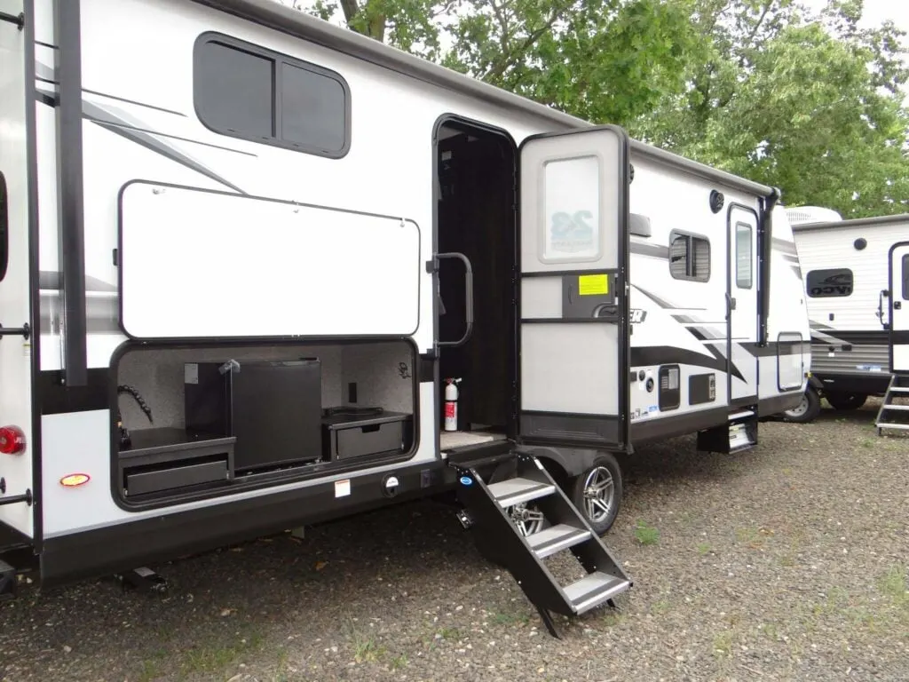 Side view of the New 2022 Jayco Jay Feather 24BH Travel Trailer RV.