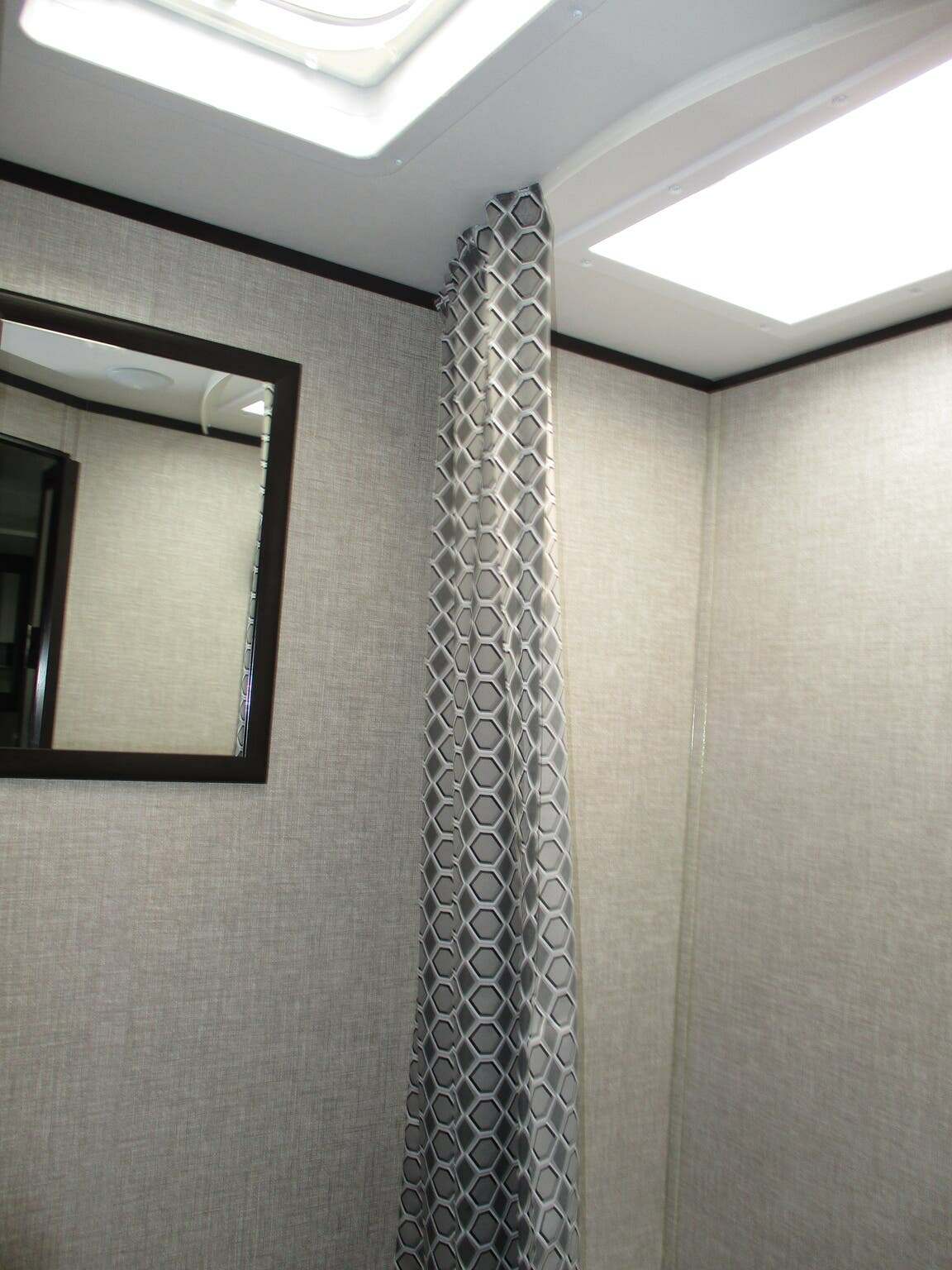 Bathroom with a shower and skylight.