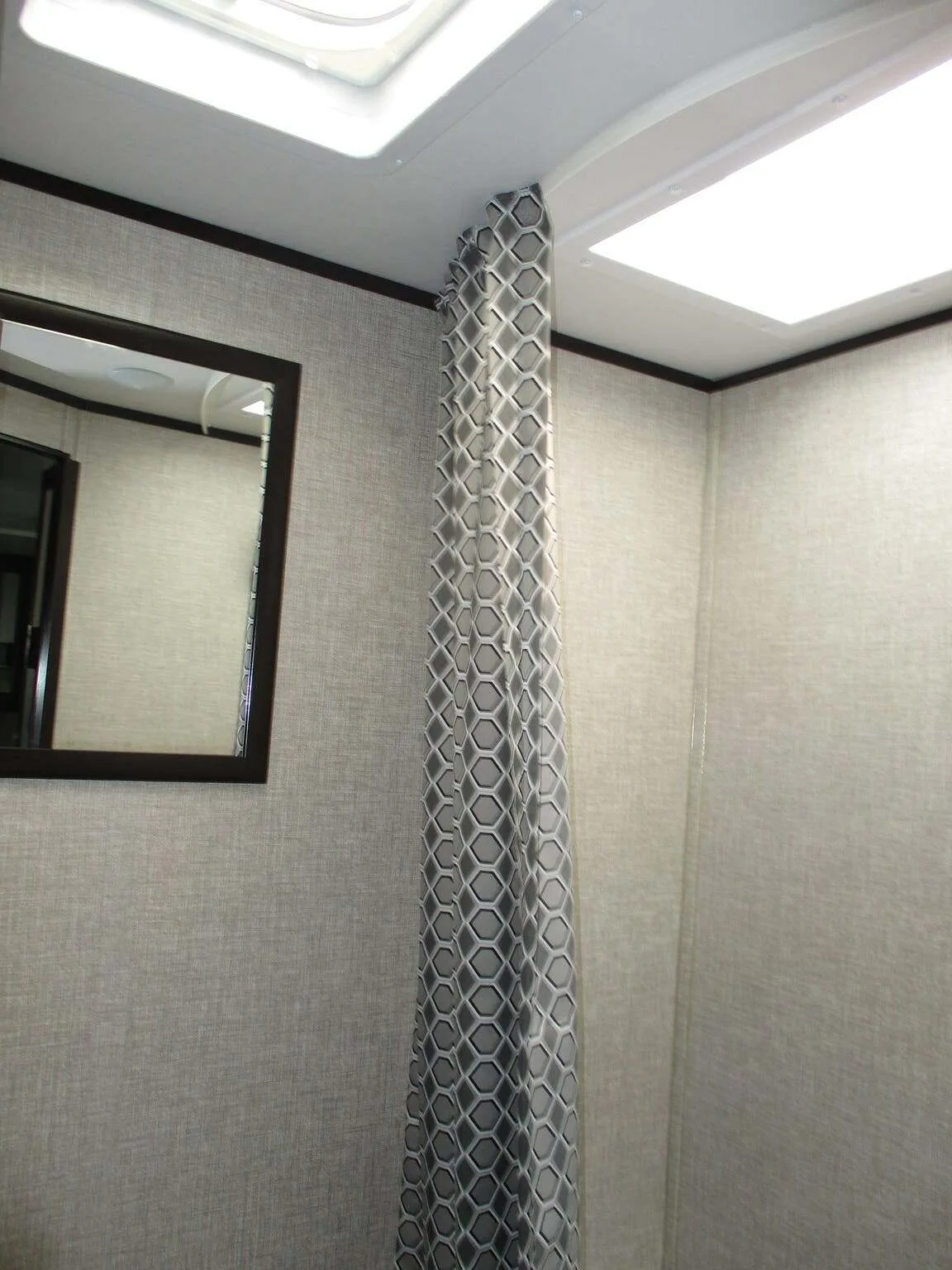 Bathroom with a shower and skylight.