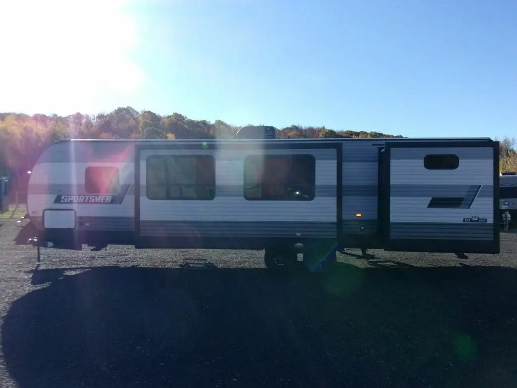 Side view of the New 2022 Kz Rv Sportsmen SE 312BHKSE Travel Trailer RV.