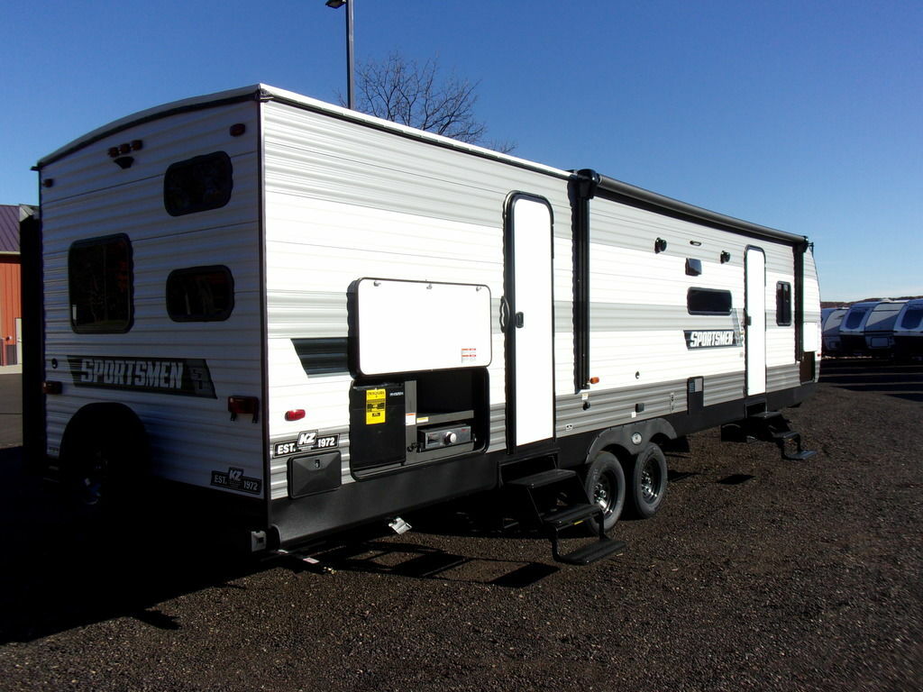 Side view of the New 2022 Kz Rv Sportsmen SE 312BHKSE Travel Trailer RV.