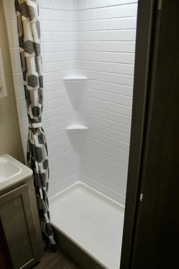 Bathroom with a sink and a shower.