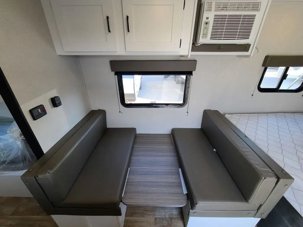 Dinette with overhead cabinets.