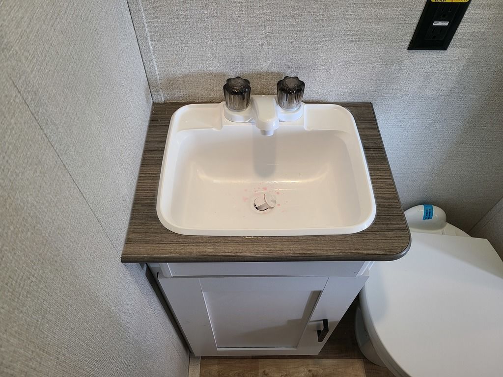 Bathroom with a sink and a toilet.