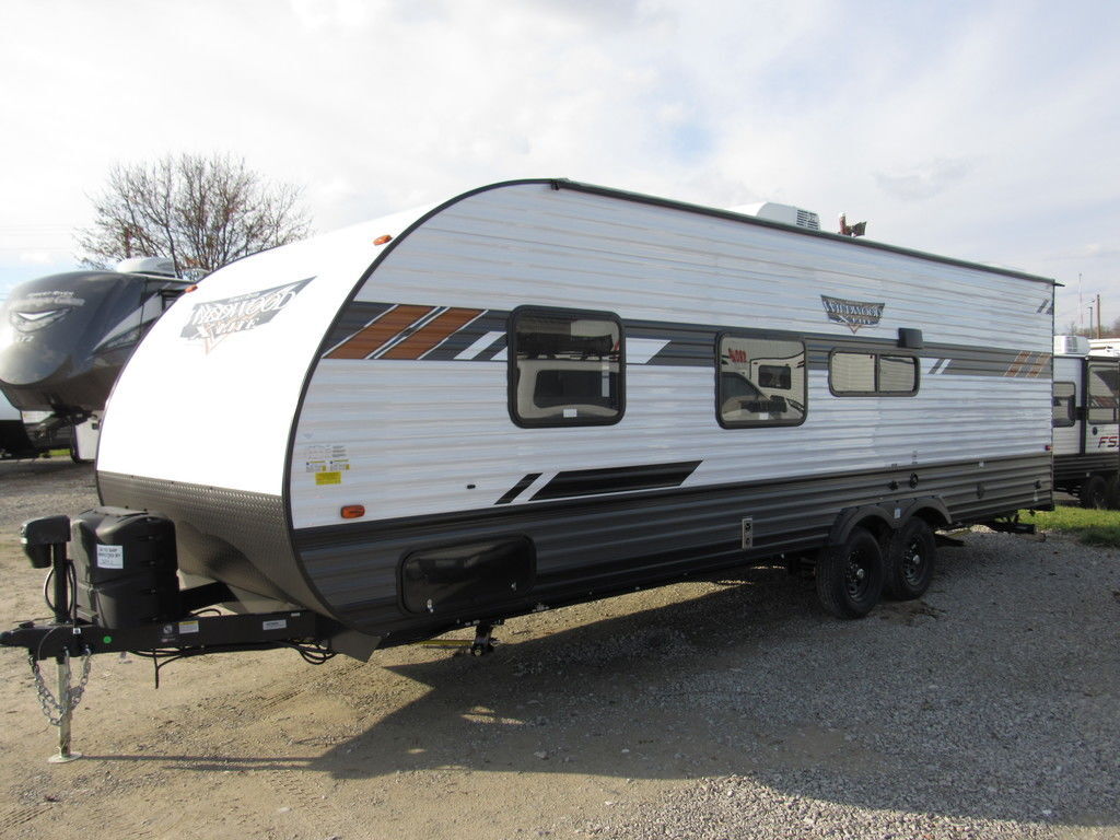 Side view of the New 2022 Forest River Wildwood X-Lite Midwest 261BHXL Travel Trailer RV.