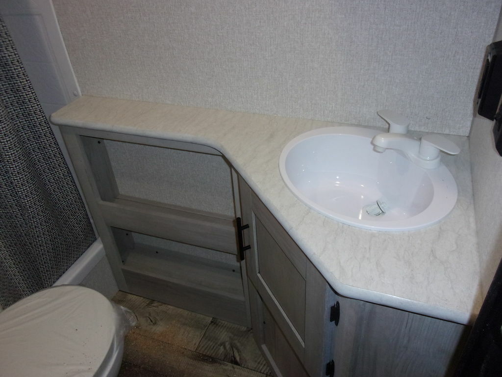 Bathroom with a sink and a toilet.