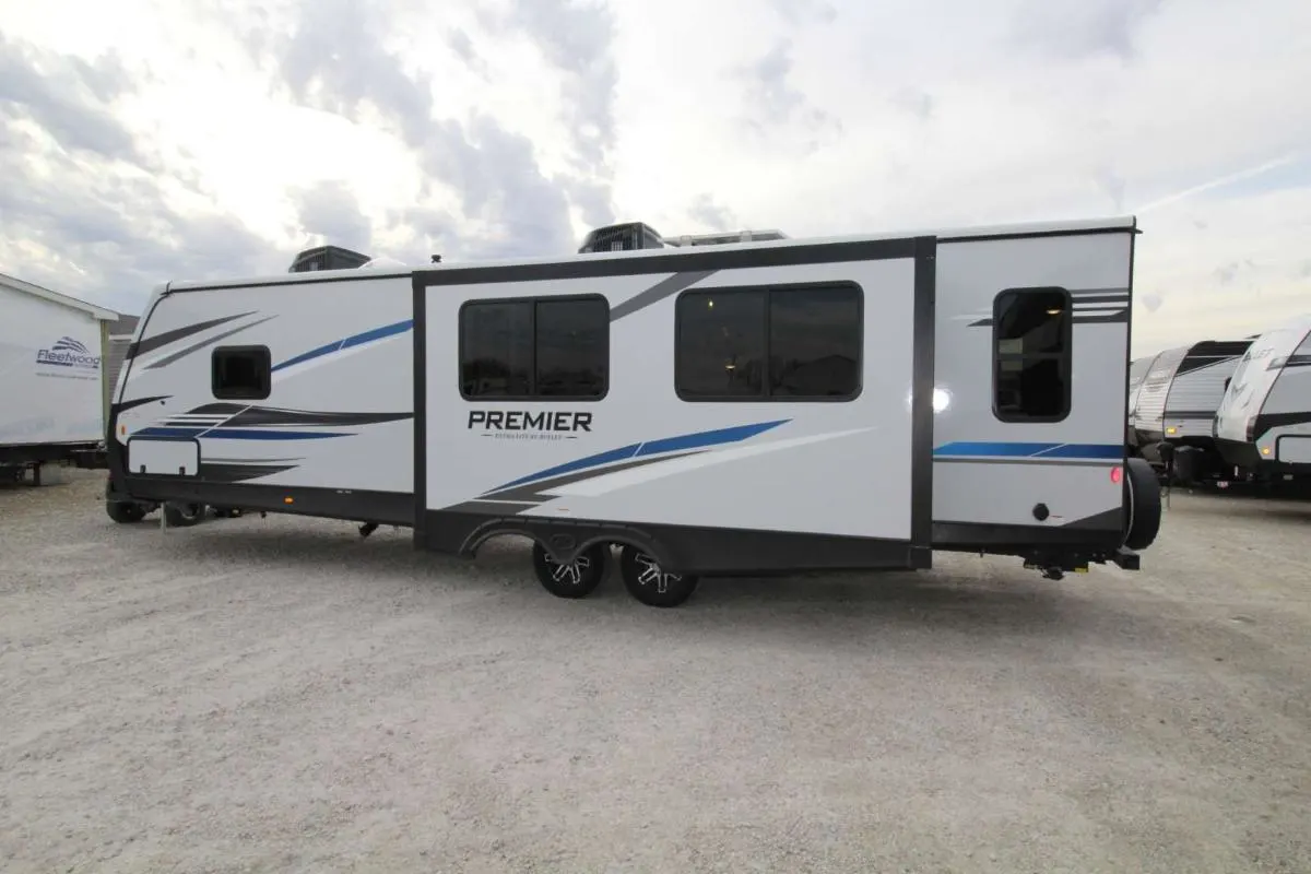 Side view of the New 2022 Keystone Bullet Premier 30RIPR Travel Trailer RV.