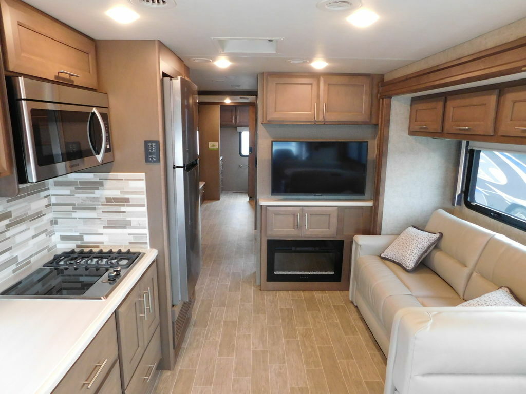 Interior view of the RV with a living space and a kitchen.