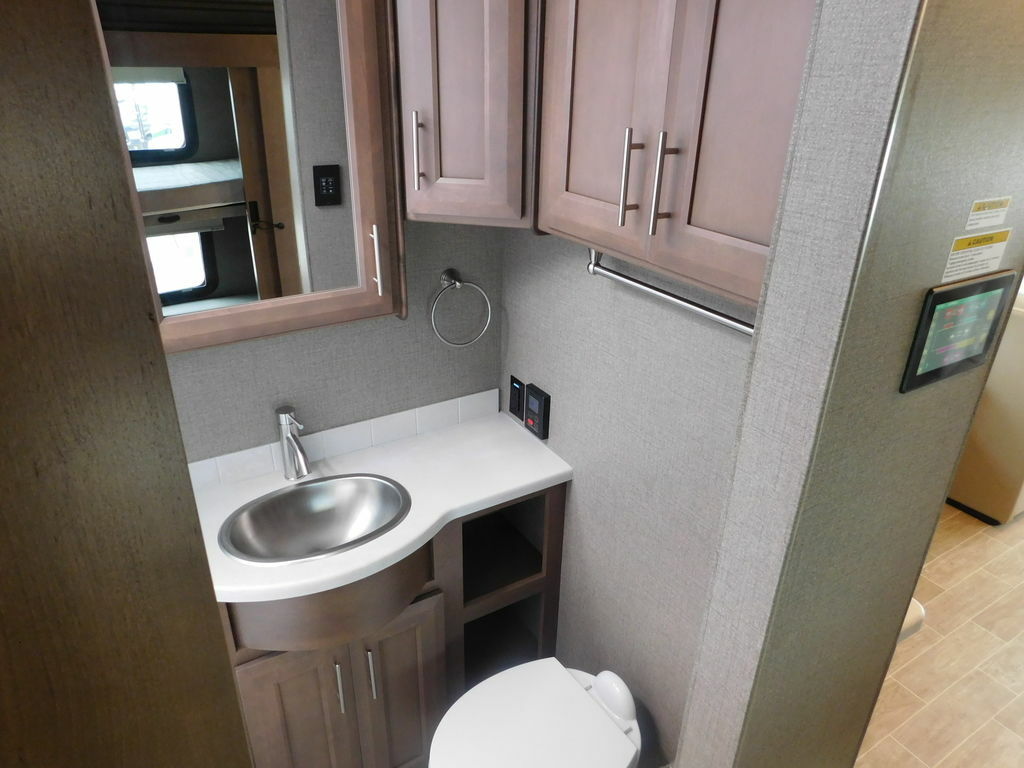 Bathroom with a sink, medicine cabinet and a toilet.