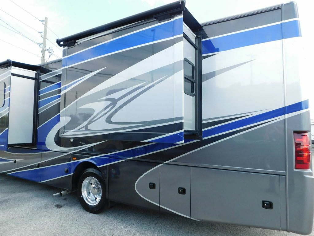 Side view of the RV with slide outs.