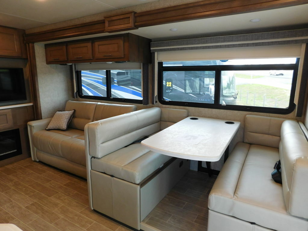 Dinette flanked by leather seats.