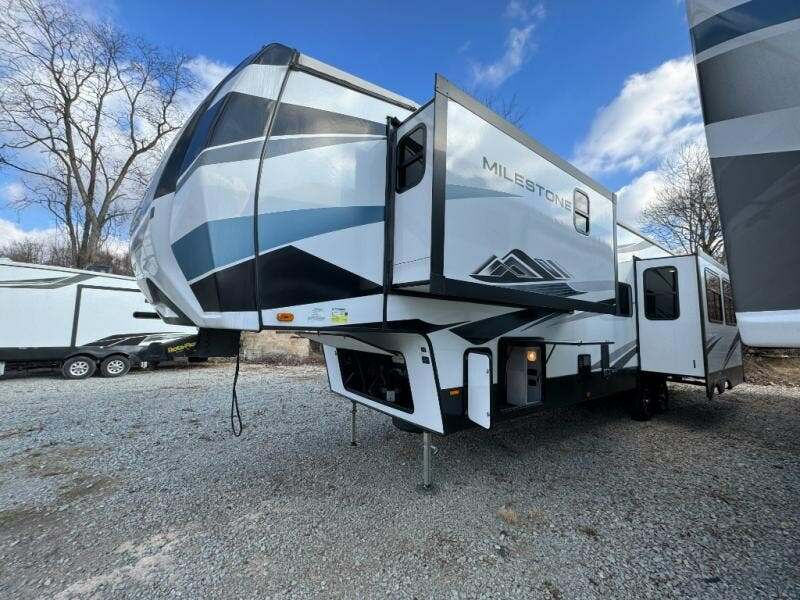 Side view of the RV with slide outs.